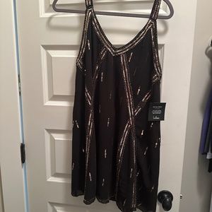 Black and gold sequin dress
